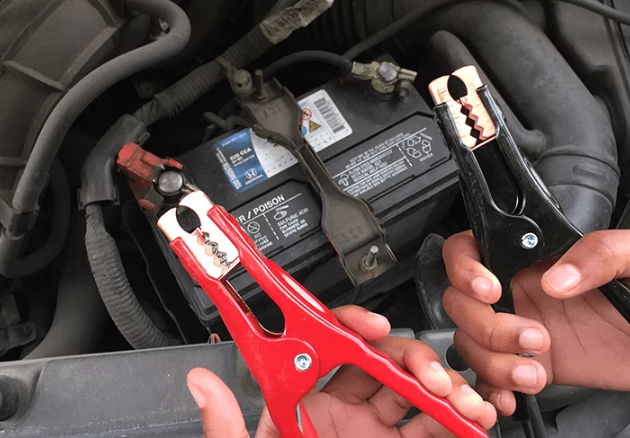 A person trying to make a Jump-Start of her Car